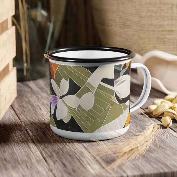 A Montessori Discovery Enamel Cup Mug with abstract digital artwork design set on a wooden surface next to grains and nuts, emphasizing its outdoor aesthetic.